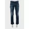 Men's straight-leg jeans with a distressed effect