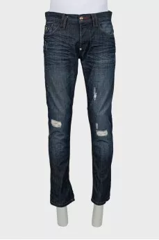 Men's blue jeans with distressed effect