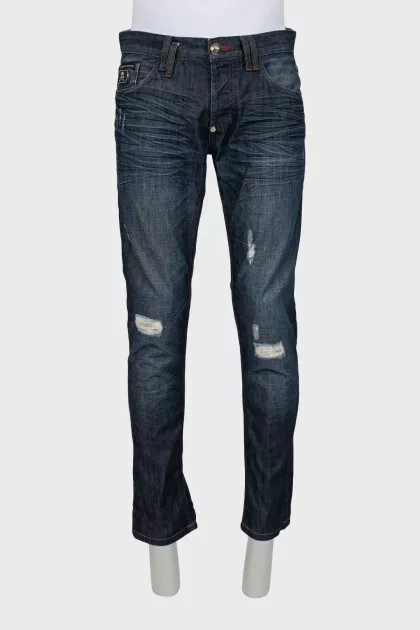 Men's blue jeans with distressed effect