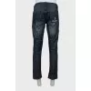 Men's blue jeans with distressed effect