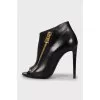 Ankle boots with golden zipper