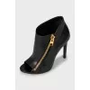 Ankle boots with golden zipper