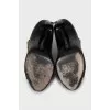 Ankle boots with golden zipper