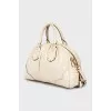 Leather bag with gold logo