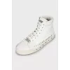 Leather sneakers decorated with studs