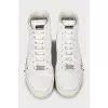 Leather sneakers decorated with studs