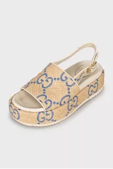 Woven sandals in signature print