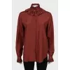 Shirt decorated with frills