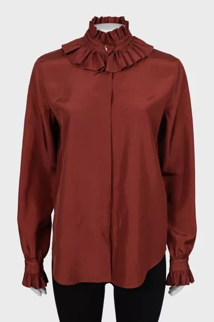 Shirt decorated with frills