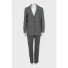Suit with trousers in checkered print