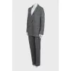 Suit with trousers in checkered print