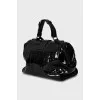 Embossed patent leather bag