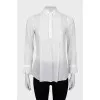 Sheer blouse with ruffled cuffs