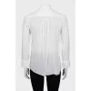 Sheer blouse with ruffled cuffs