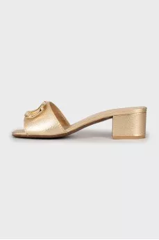 Gold sliders with signature logo