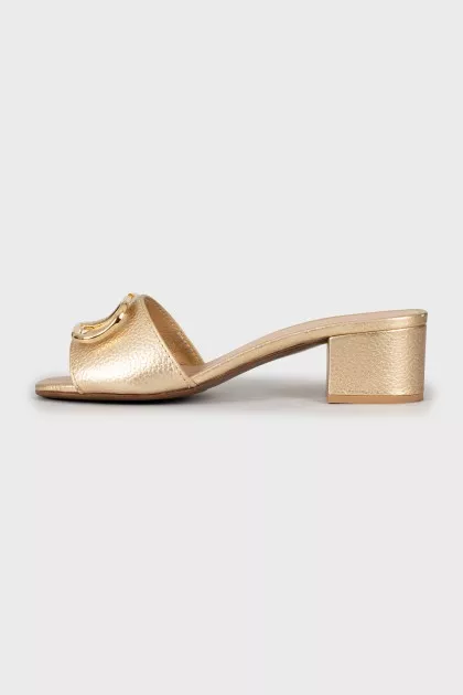 Gold sliders with signature logo