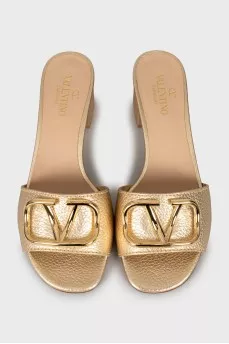 Gold sliders with signature logo