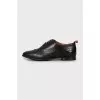 Leather brogues with decorative perforations