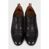 Leather brogues with decorative perforations