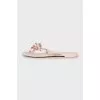 Rubber flip-flops with gold spikes