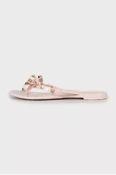 Rubber flip-flops with gold spikes