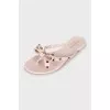 Rubber flip-flops with gold spikes