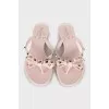 Rubber flip-flops with gold spikes