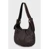 Leather shoulder bag with buckles