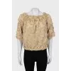 Blouse decorated with flowers and frills