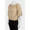 Blouse decorated with flowers and frills
