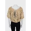 Blouse decorated with flowers and frills