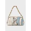 Shoulder bag with leather inserts