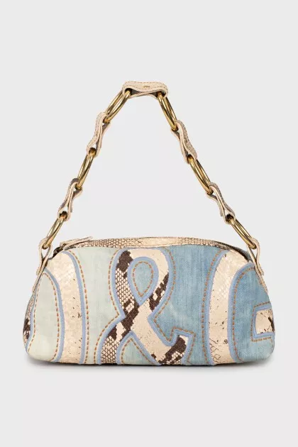 Shoulder bag with leather inserts
