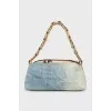 Shoulder bag with leather inserts