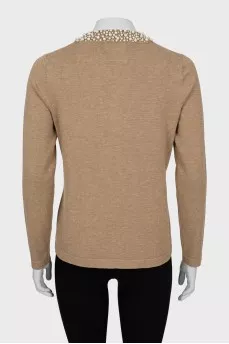 Knitted cardigan decorated with beads