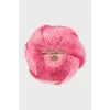 Knitted brooch in the shape of a flower