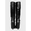 Black leather boots with heels