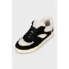 Black and white fur and leather sneakers
