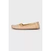 Leather moccasins with golden decoration