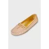 Leather moccasins with golden decoration