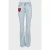 Blue flared jeans with patch