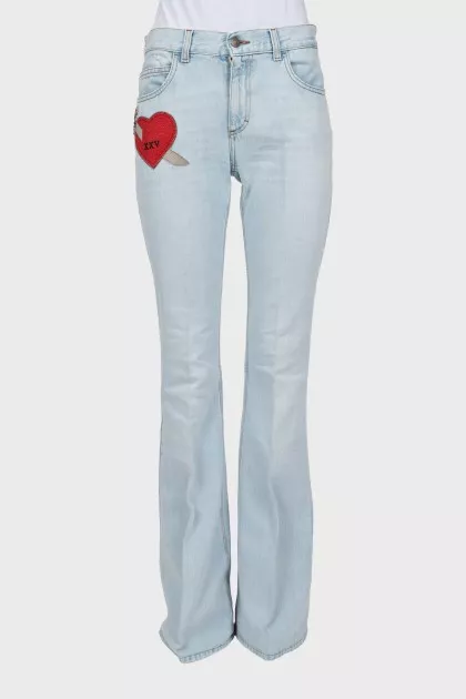 Blue flared jeans with patch