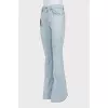Blue flared jeans with patch