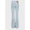 Blue flared jeans with patch