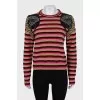 Striped sweater decorated with embroidery
