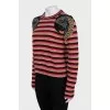 Striped sweater decorated with embroidery