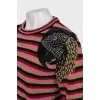 Striped sweater decorated with embroidery