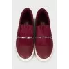 Leather slip-ons with tag