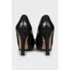 Leather shoes with wooden soles