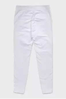 White jeans decorated with buttons